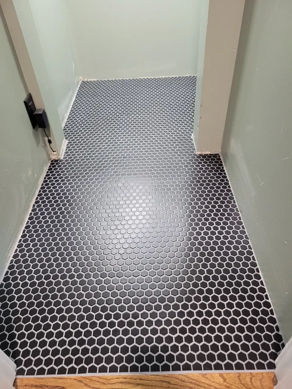 black hex mosaic floor, set and grouted