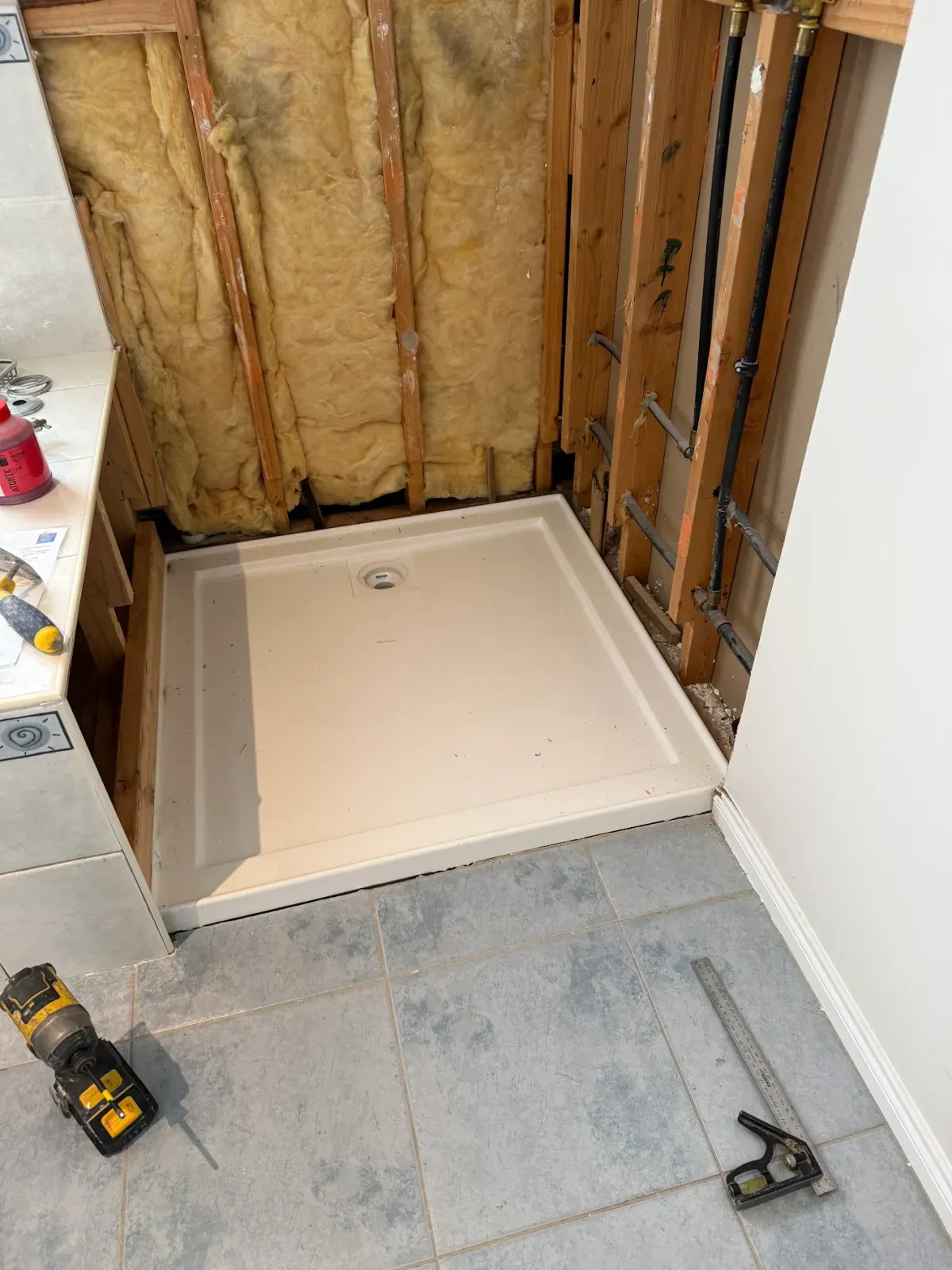 shower replacement during the build: walls opened and a new base set
